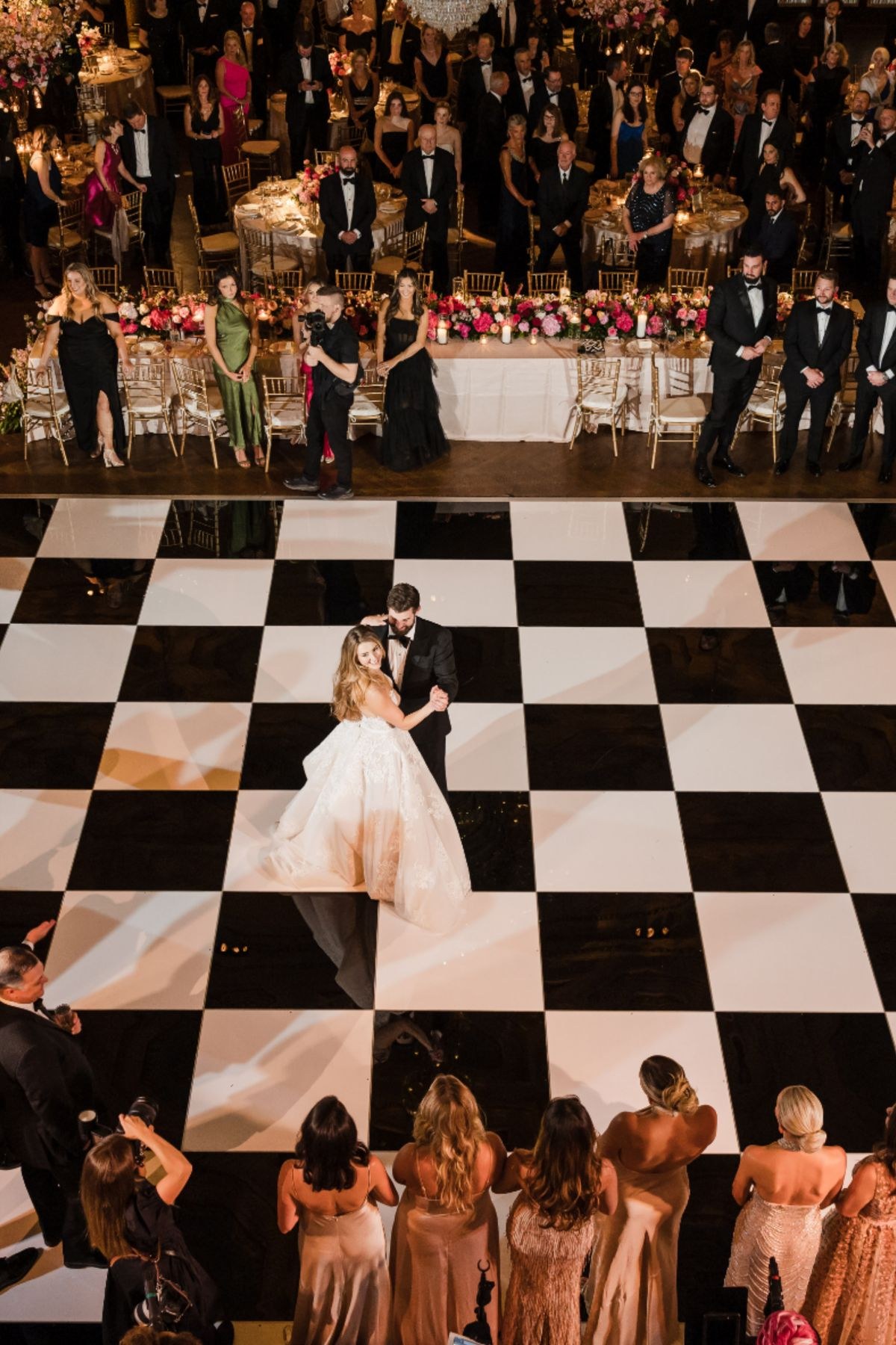 Checkerboard dance floor set up for an outdoor evening reception with a sparkler send off in Tulsa